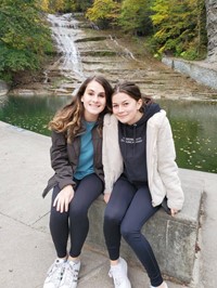 students near waterfall