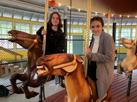 two students on carousel