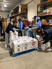students helping at chow warehouse
