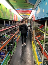 students walking through cooler with food