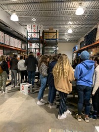 students in chow warehouse