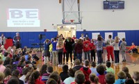 wide shot of students playing activity based on being present