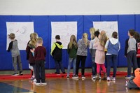 medium shot of students drawing