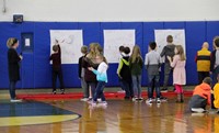 wide shot of students drawing