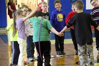 close shot of students taking part in teamwork activity