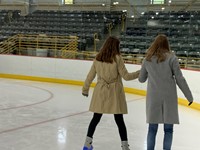 two students ice skating