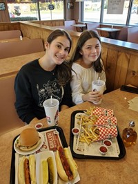 students eating at restaurant