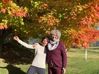 french teachers standing next to fall foliage
