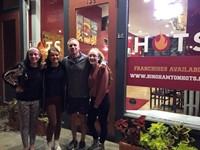 students outside of restaurant