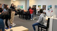 students playing corn hole