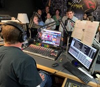 student talking to radio host