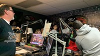 student talking in radio station studio