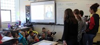 french students talking to elementary class