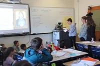 french students talking to elementary class