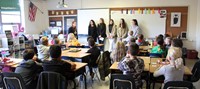 french students talking to elementary class