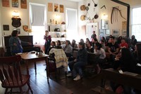 students listening to presenter in chenango school house museum