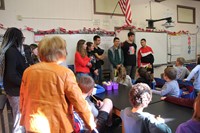 french students talking to elementary class