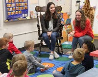 french students talking to elementary class