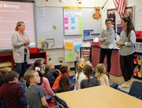 french students talking to elementary class