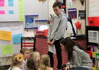 french students talking to elementary class