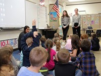 french students talking to elementary class