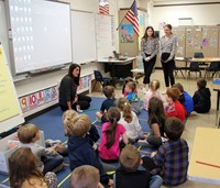 french students talking to elementary class