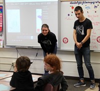 french students talking to elementary class