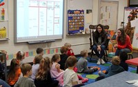 french students talking to elementary class