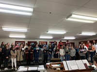 students singing in chorus room