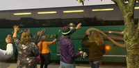 people waving to bus