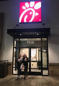 students standing outside chick-fil-a