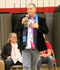 honoree adam cornell speaking at port dickinson elementary event