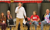 student introducing honoree gary butch at port dickinson elementary event