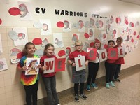 students with welcome sign at port dickinson elementary