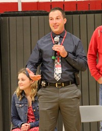 distinguished community member robert stapleton speaking at port dickinson elementary event