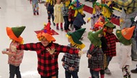 students in scarecrow hats at pre k halloween parade