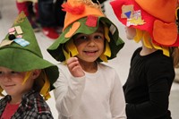 student smiling wearing scarecrow hat