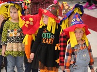 students wearing scarecrow hats