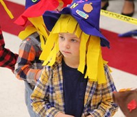 student wearing scarecrow hat
