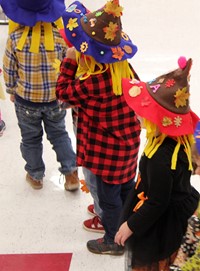 students wearing scarecrow hats