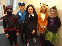 five students in costumes