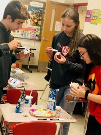 high school students taking part in halloween activity