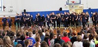 middle school students sharing performing brief sneak peek for Chenango Bridge students