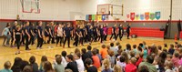 wide shot of middle school students performing snippet in Port Dickinson Elementary gym