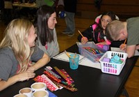 two students and two adults activity station