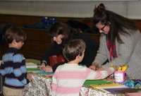 students and adults at activity station