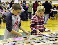 two students looking at books