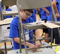 middle school students taking part in engineering day activity