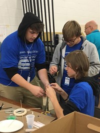 high school students taking part in engineering day activity