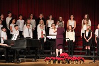 medium shot of sixth grade chorus members singing